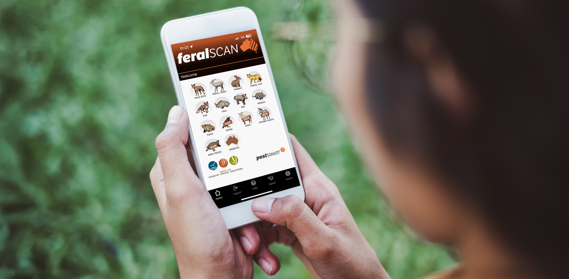 woman using FeralScan app in park